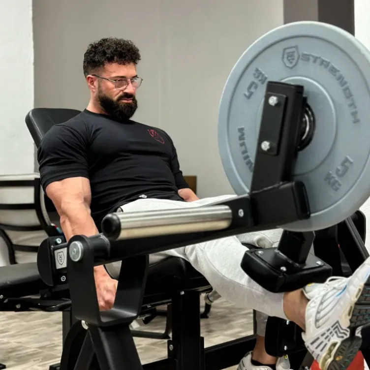 Plate loaded Titanium Strength leg extension iso-latérale Élite Séries EL-PL4 - Musculation des quadriceps charge libre