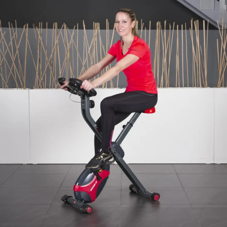 Vélo d'appartement Xbike avec structure en acier pliable et roues de transport - Système de freinage magnétique