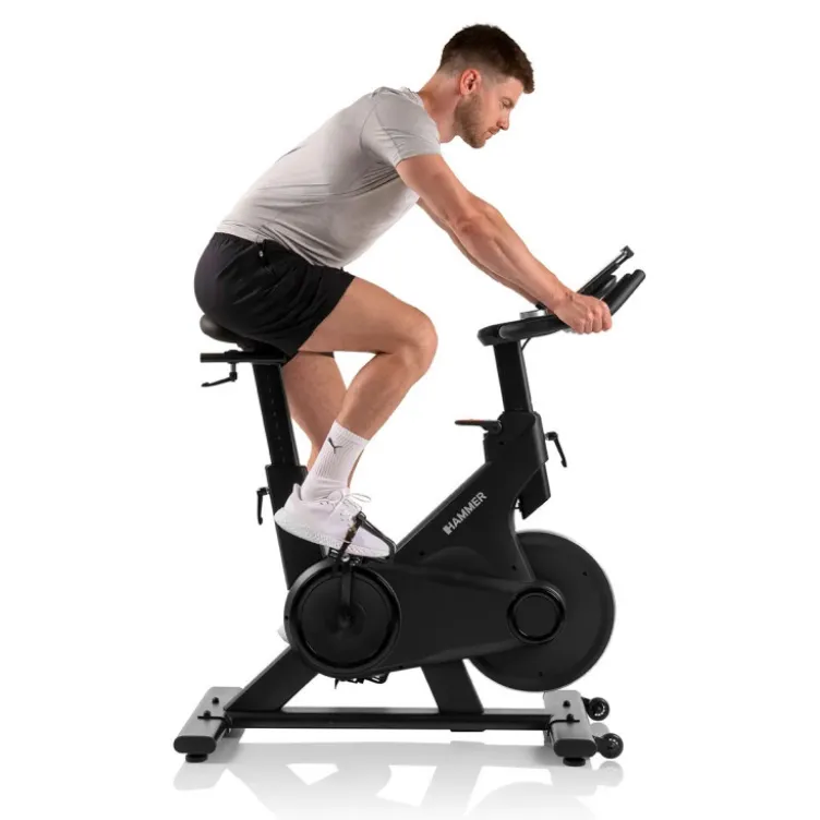 Vélo spinning de cardio Speed Race X avec roue d'inertie de 20 kg - 32 niveaux de résistance et écran HD