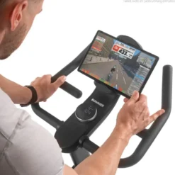 Vélo spinning de cardio Speed Race X avec roue d'inertie de 20 kg - 32 niveaux de résistance et écran HD