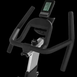 Vélo spinning professionnel Racemachine ATX avec volant d'inertie de 18 kg et écran multifonction pour séances intensives
